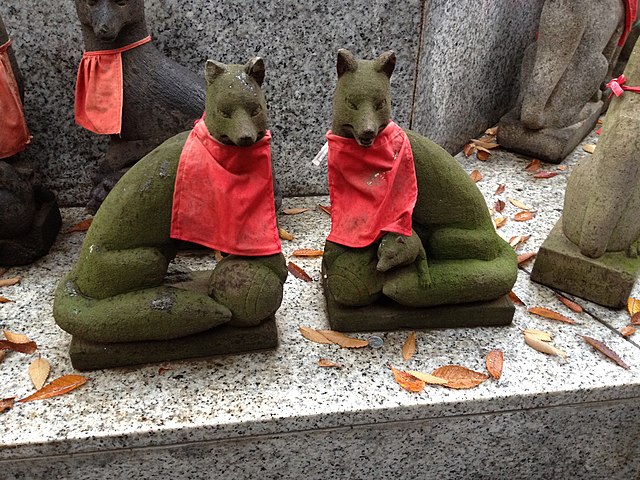 Photo of Japanese kitsune or fox spirit statues