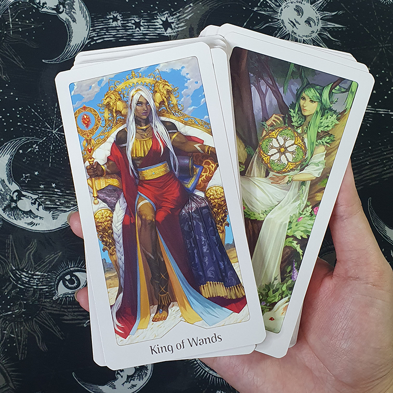 The King of Wands and Queen of Laurels cards from Noa Ikeda's Heavenly Bloom Tarot Deck. 