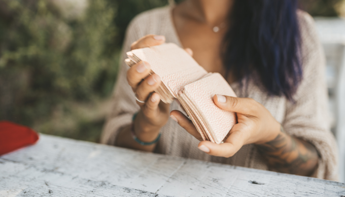 A tarot reader shuffling her cards