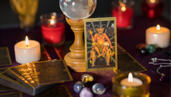 image of the devil tarot card on a table to illustrate common myths about tarot in the philippines
