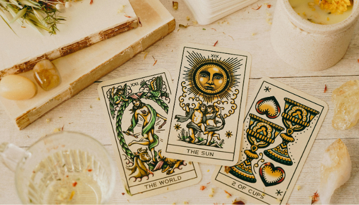 photo of three tarot cards on a table