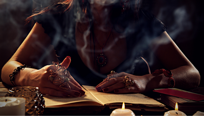 photo of woman reading a grimoire