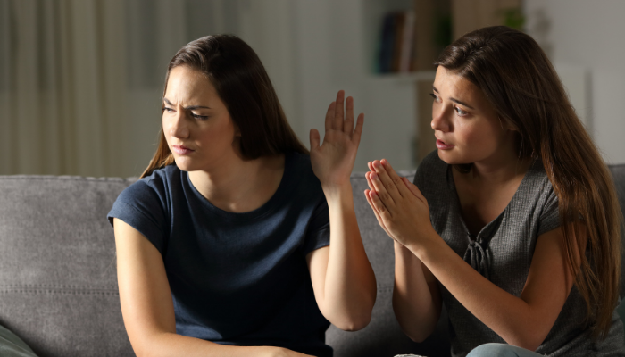 woman setting a boundary and refusing someone begging
