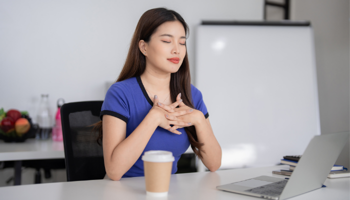 woman working at desk but taking it slow