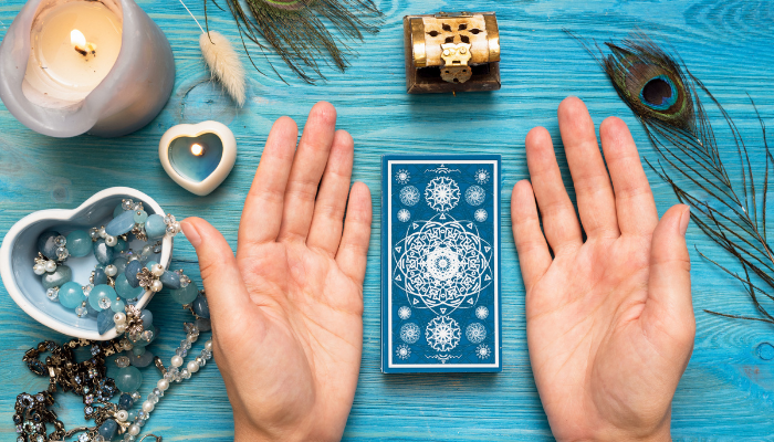 tarot reader preparing for a reading with a blue-colored setup